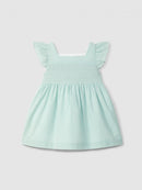 Dress in textured cotton with smocking on the chest