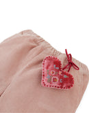Baby Bessie Pants with Scallop- Embroidered Hem, Ruffles, and Hand- Embroidered Velvet Heart Plushie (Pink)